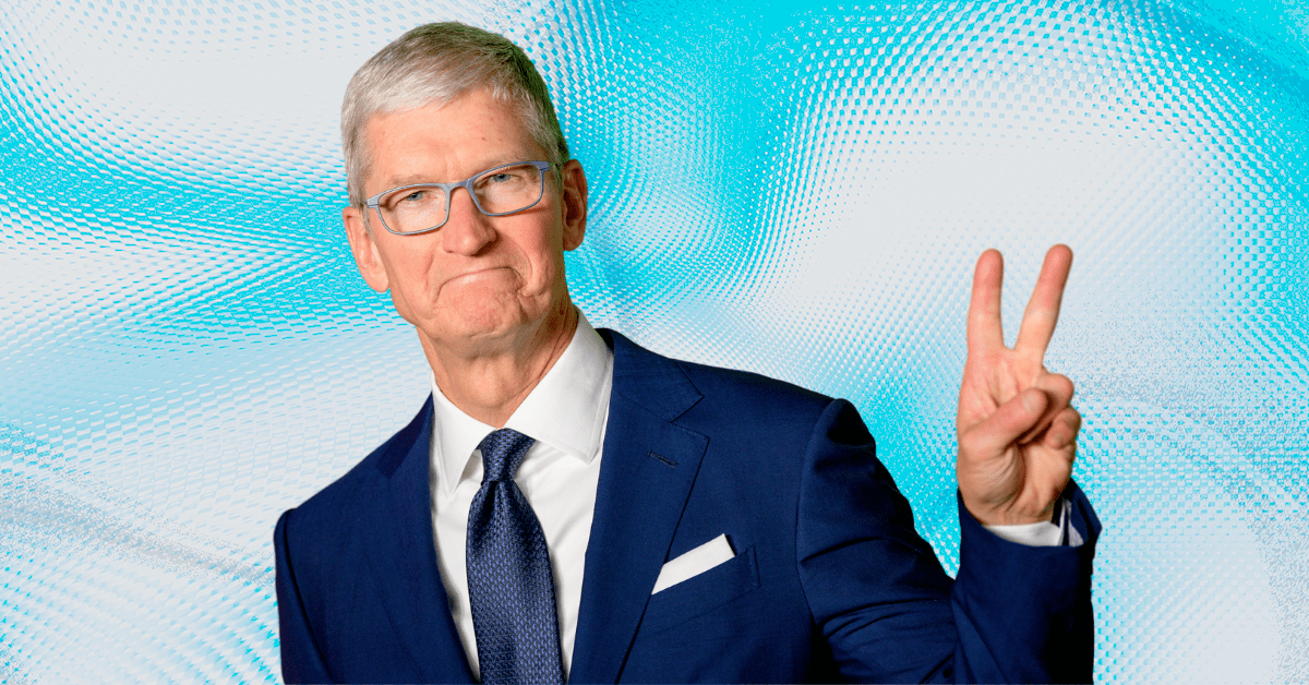 Tim Cook wearing a suit giving a peace sign to the camera.