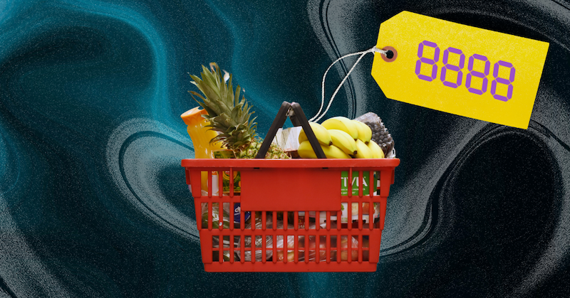 A yellow price tag with digital numbers on it is attached with white string to a red basket full of groceries.