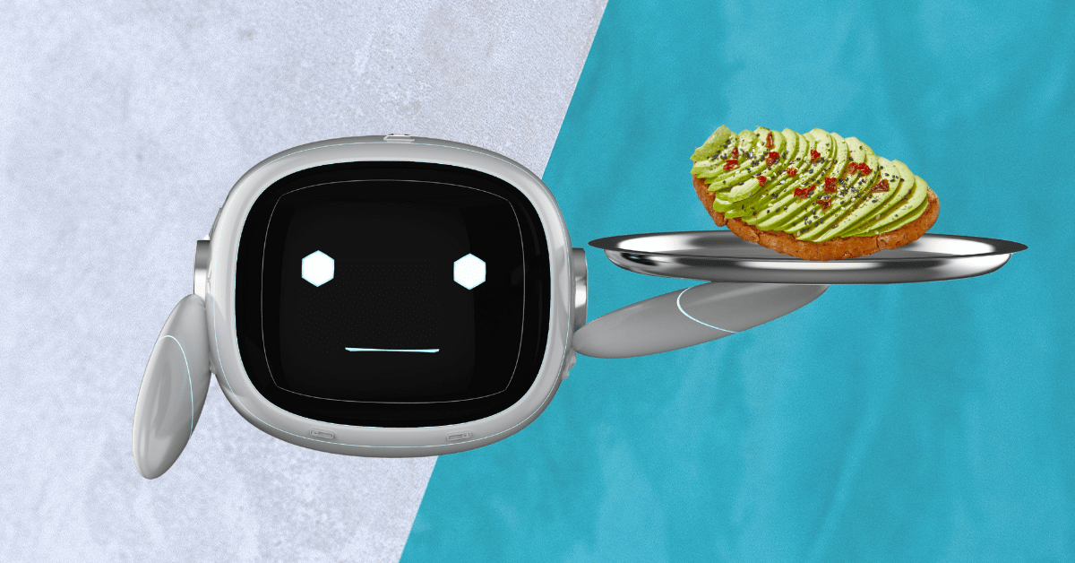 A robot holding a silver tray with a piece of avocado toast on it.